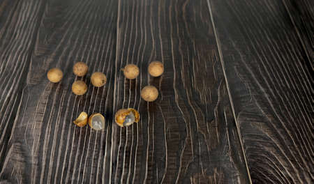 longan lay on a wooden background with copy space.の写真素材