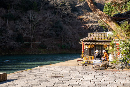 View of a teahouse along the peaceful riverのeditorial素材