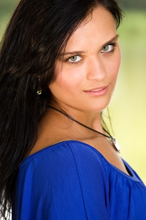 Portrait of beautiful young sexy woman on green background の写真素材