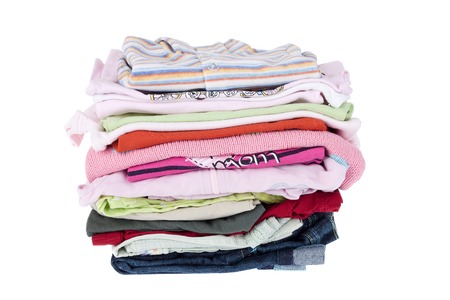 Pile of baby clothes isolated on white の写真素材
