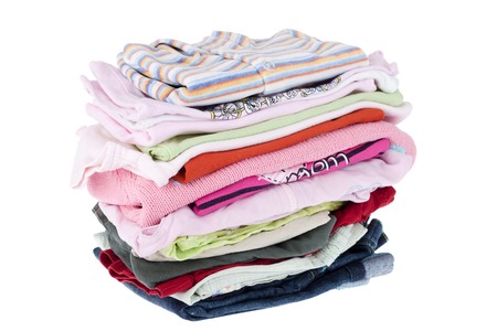 Pile of baby clothes isolated on white の写真素材