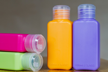 Small colored plastic bottles for traveling