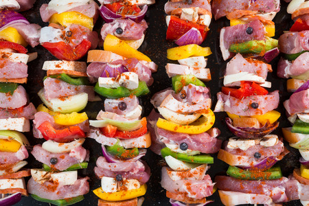 Raw pork skewers ready for grillingの写真素材