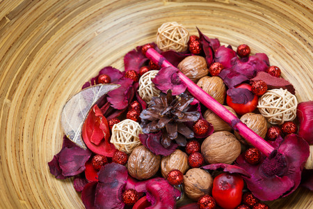 Natural colored decoration of nuts in wooden bowlの写真素材