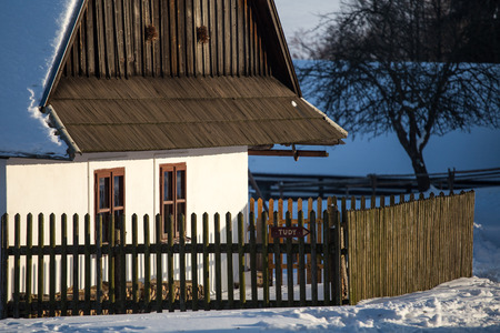 Traditional wooden timbered cottage in winter. Folk museum in Vesely Kopec, Czech Republicの写真素材