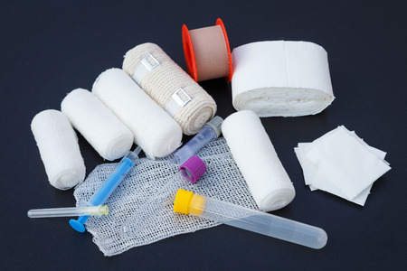 Medical bandages with sticking plaster and syringes for medical,healthcare or pharmacy themesの写真素材