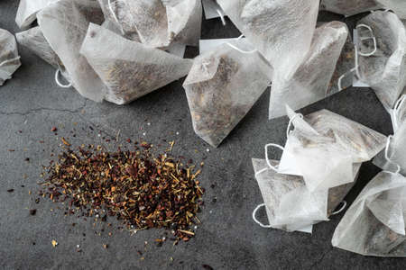 Pyramid tea bags on gray background