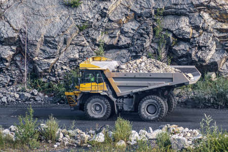 Dump truck in limestone mining, heavy machinery. Mining in the quarry.の写真素材