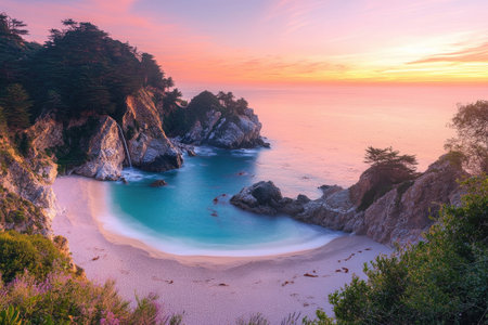 Mcway falls dropping on a beautiful sandy beach at sunset, creating a magical atmosphere in big sur, californiaの素材