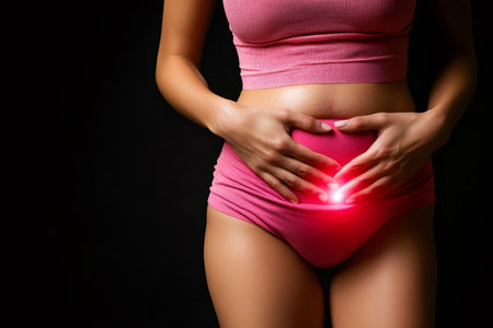 Woman suffering from abdominal pain, possibly related to menstruation, highlighted by a red glowの素材