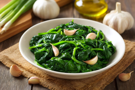 Delicious and healthy steamed spinach with garlic, ready to be enjoyed as a side dish or part of a balanced mealの素材