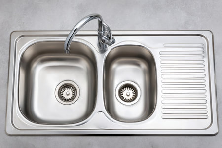 Shiny double sink with integrated drainer on a sleek countertopの素材