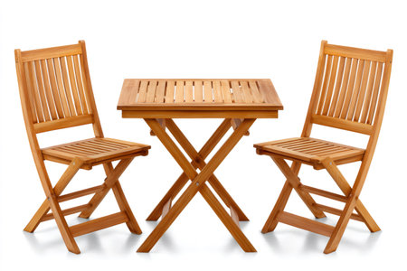 Folding wooden table and chairs isolated on white background, ideal for outdoor dining or small spacesの素材
