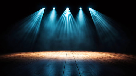 Four spotlights illuminating an empty stage with wooden floor and smokeの素材