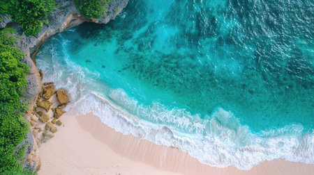 Aerial view of turquoise water of tropical lagoon washing sandy beach between cliffsの素材