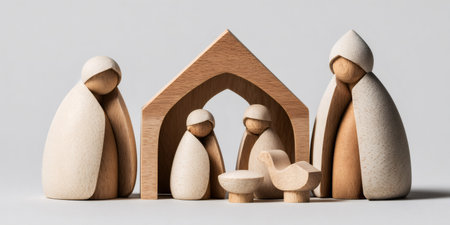 Wooden nativity scene figurines of the holy family and shepherd or wise man, symbolizing Christmasの素材