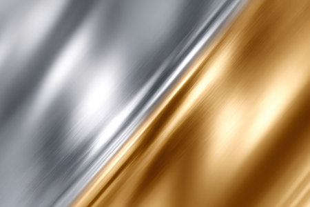 Metallic surface showing a shimmering gradient from golden to silver colorsの素材
