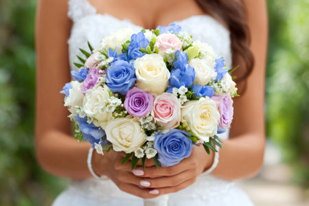 Bride carrying beautiful vibrant floral wedding bouquet, celebrating love and marriageの素材