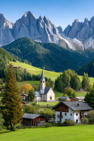 Picturesque san giovanni church in val di funes valley with towering dolomites mountainsの素材