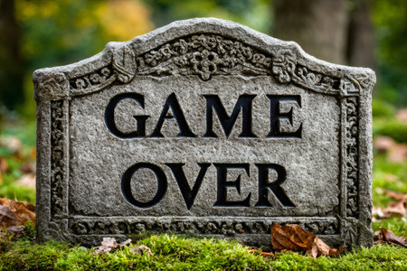 Grave marker with game over message expressing an end conceptの素材