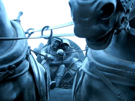Oklahoma land run in a wagon statue.の写真素材