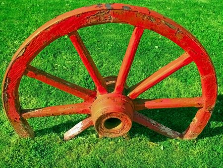 Old red wagon wheel.の写真素材