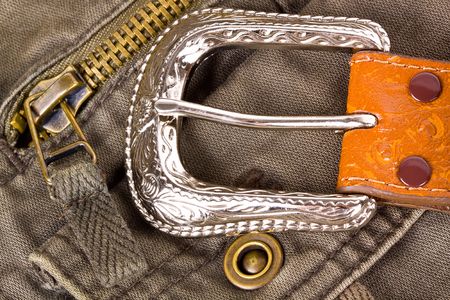 Leather belt on khaki pants.の写真素材