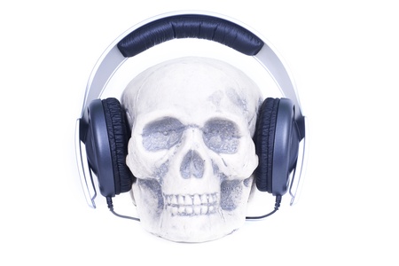 Human skull with music headphones.の写真素材