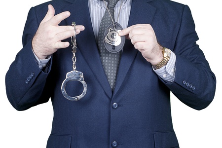 Police office with gun and handcuffs in actionの写真素材