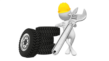 Tire mechanic holding a wrenchの写真素材