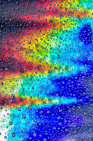 background of a rainbow of water droplets