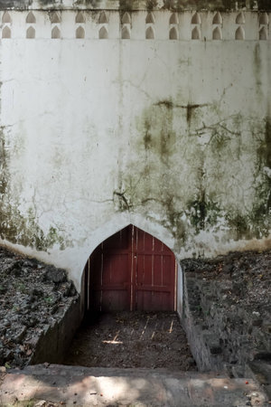 An antique wall wall grunge texture with little red wooden exitの写真素材