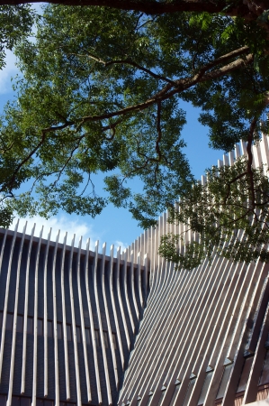 Close-up shot, with strong composition, lines directed toward blue sky, history museum Daklak is...