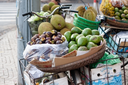 SAI GON, VIET NAM- JULY 21: Fruit store of street vendor on bicycle, Sai Gon, Viet Nam on July 21, 2013のeditorial素材