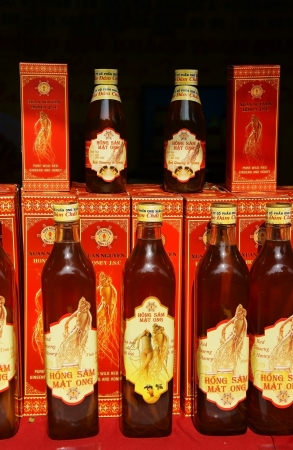  Pure red ginseng and honey in glass bottes showing on store in Ho Chi Minh city, Viet Nam on Dec 12, 2013のeditorial素材