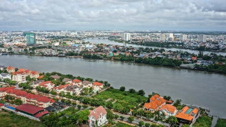 HO CHI MINH CITY ( SAI GON), VIET NAM- SEP 15: Cityscape of Ho Chi Minh city with Sai gon river among urban,  highrise buidling rise up to sky and serried of concrete house  in Ho Chi Minh, Vietnam on Sep 15, 2012