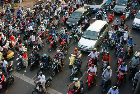 HA HOI, VIET NAM- APRIL 18  Amazing trafic of Asia city, group citizen on private vehicle in rush...