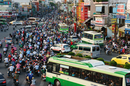HO CHI MINH, VIET NAM- APRIL 18  Overview of urban trafic at Asia city, group Asian citizen on private vehicle in trafic jam, crowded, overloaded, mob of people move slow, Vietnam, April 18, 2014のeditorial素材