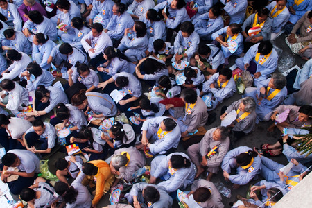 HO CHI MINH CITY, VIETNAM- MAY 5  Impression overview with overcrowded of buddhist in grey dress uniform, sitting on yard of Pagoda on anniversary of buddhaのeditorial素材