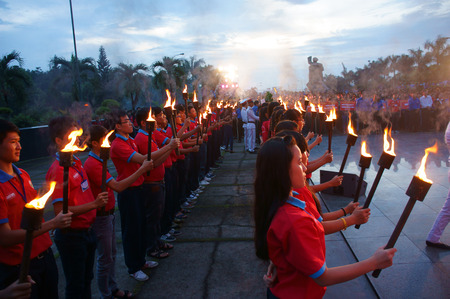 HO CHI MINH CITY , VIETNAM- JULY 26  Crowd of people standing, hold torch in July 27 event, ceremony to commenorate heroic that sacrifice in Vietnam war at martyr cemetery, Viet Nam, July 26, 2014のeditorial素材