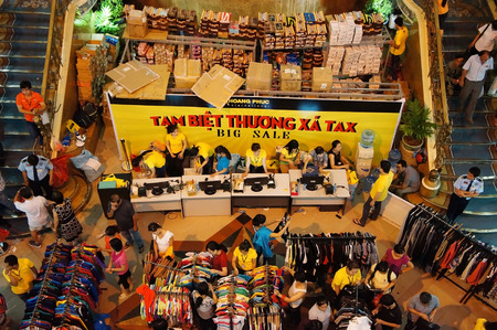 HO CHI MINH, VIETNAM- AUG 23: Crowded, busy atmosphere at Tax shoping centre, group of Asia people buy modern clothing  in sale off season, colorful store inside Tax center,  Vietnam, Aug 23, 2014のeditorial素材