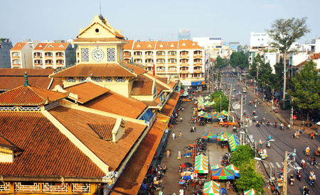 HO CHI MINH CITY, VIETNAM- AUG 22: View of Binh Tay market- is wholesale markets at chinatown- on day, orange old tile roof, crowded motorbike on street, an ancient architect, Vietnam, Aug 22, 2014のeditorial素材