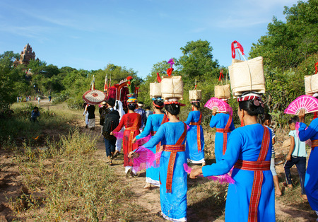 PHAN RANG, VIET NAM- OCT23: Amazing panoramic on Asian country road, crowd of Vietnamese in tradition clothing, pick up dress in Kate festival, traditional culture of Cham people, Vietnam, Oct23, 2014のeditorial素材