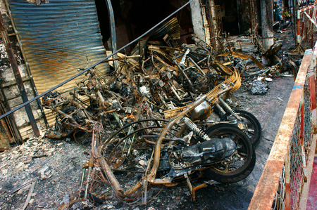 Horror fire at store in Ho Chi Minh city, Vietnam, burned vehicle as motorbike, group of motorcycle damaged, melted in ash, only frame, an fearful acctident with serious lossのeditorial素材