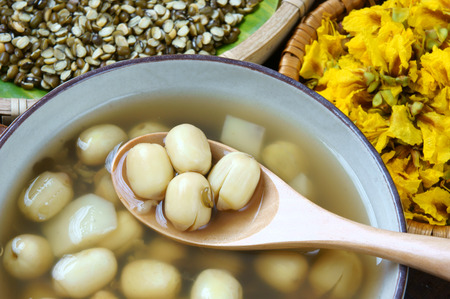 Vietnamese food, sweet lotus seed gruel, ingredients: lotus bean, mung bean, water chestnut and sugar candy. this Vietnam dish for dessert or snack, very delicious, tasty, nutrition, make sleep wellの写真素材