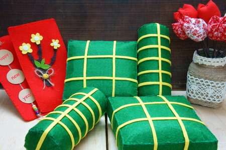 Vietnamese food,  banh chung, banh tet are traditional eating on Tet holiday, wrap in green leaf. When spring come, on Vietnam Lunar New Year , people worship the ancestor with glutinous rice cakeの写真素材