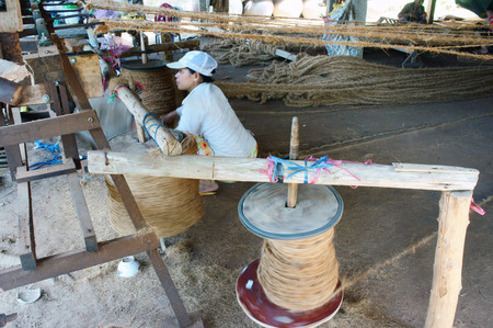 BEN TRE, VIET NAM- JUNE 1: Asian worker work inside coir mat workshop, Vietnamese woman work traditional craft, coconut matting to export, coconut fiber material at Mekong Delta, Vietnam, June 1, 2015のeditorial素材