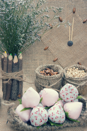 Art idea with funny monkey for happy new year 2016, new year eve time, handmade monkey face, clockwise, colorful  hand made fruit, fibre strawberry, flower decor on burlap background, vintage conceptの写真素材
