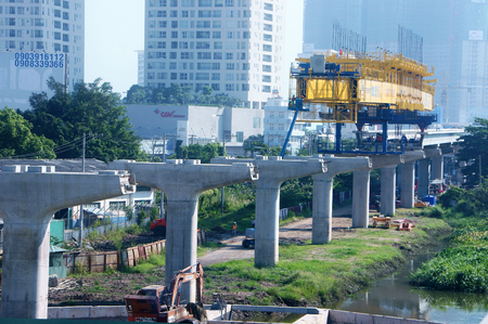 HO CHI MINH CITY, VIET NAM- NOV 17: Group of Asian construction worker working on overhead crane at metro project, an overhead railway for urban traffic development, Saigon, Vietnam, Nov 17, 2015のeditorial素材
