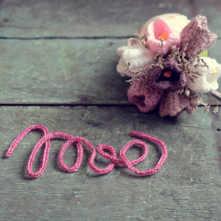 Love background, handmade flower make from yarn, knitted love, meaningful for valentines day or mother day, amazing diy for holidayの写真素材